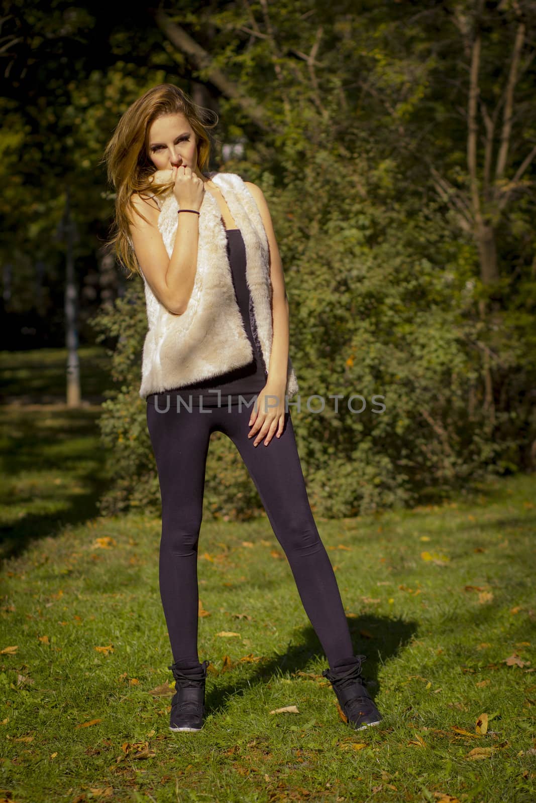 Young, beautiful woman in the city park