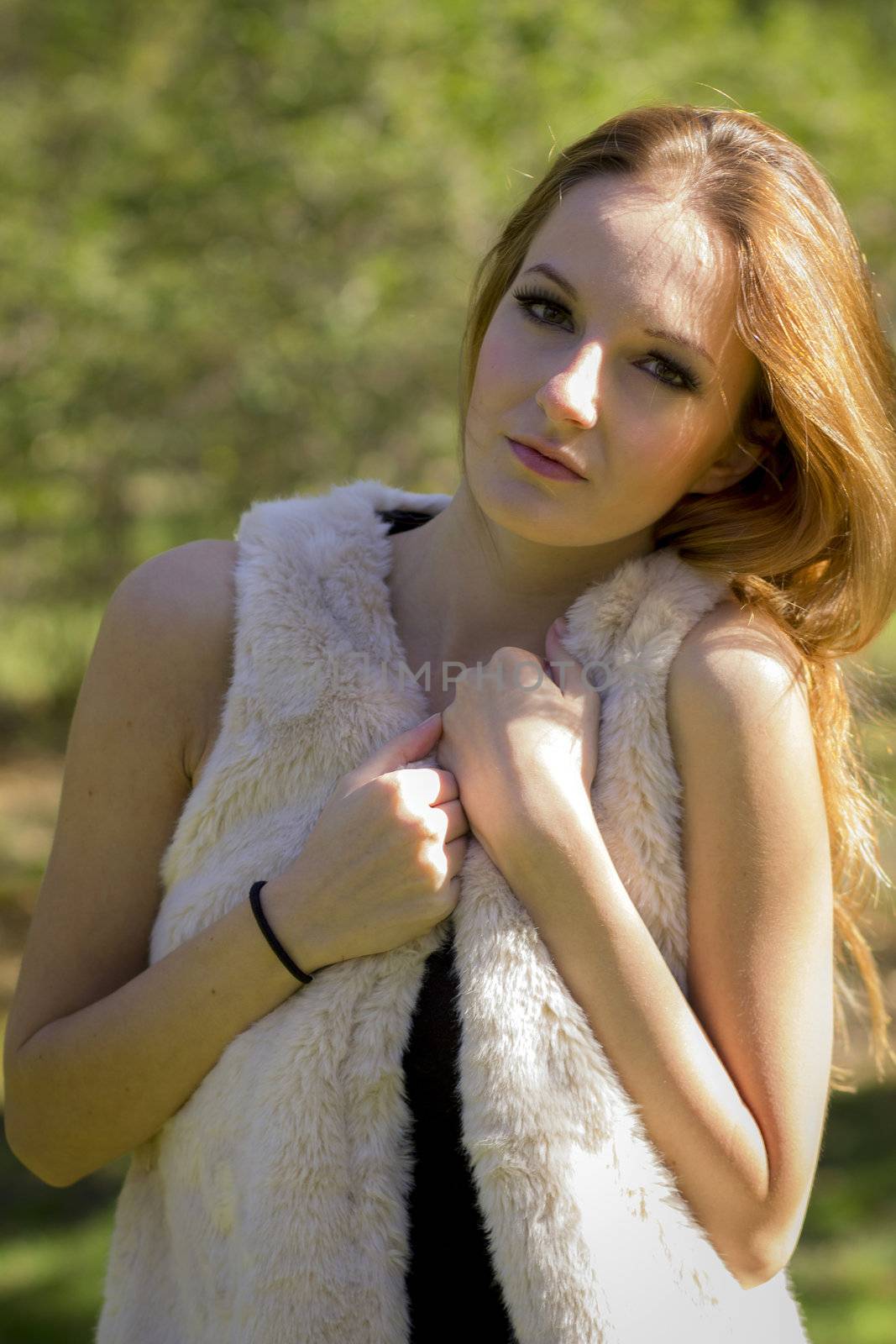 Young, beautiful woman in the city park