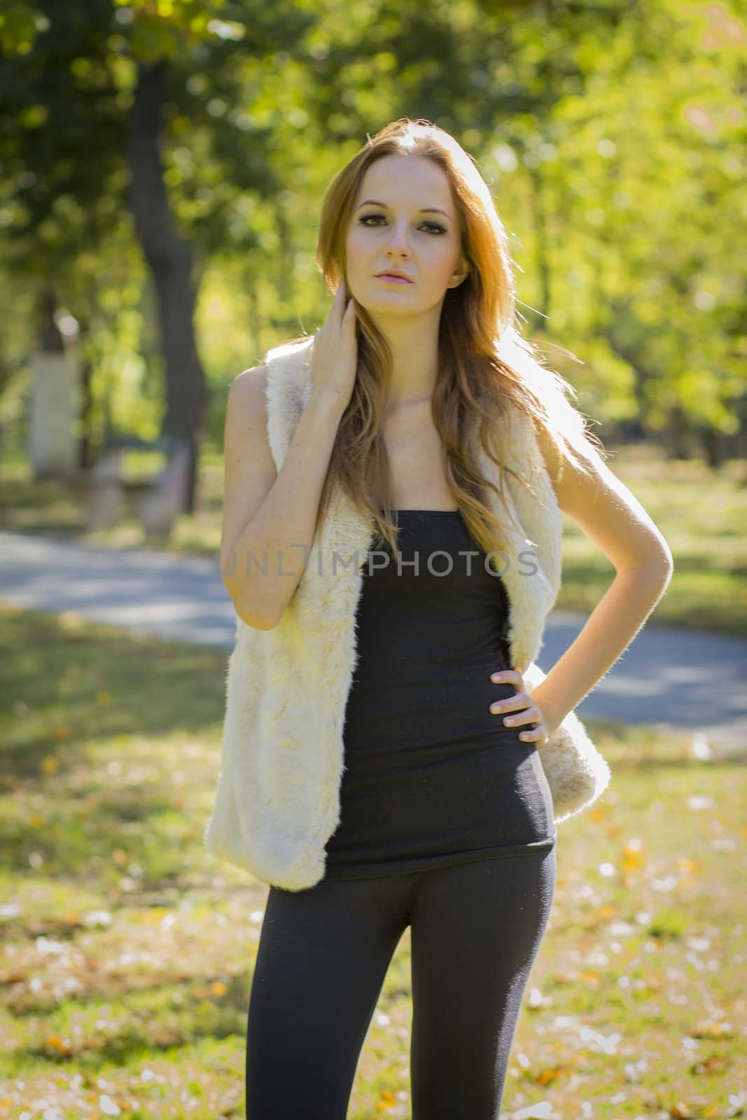 Young, beautiful woman in the city park