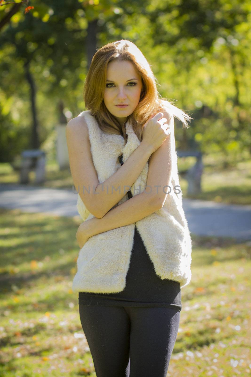 Young, beautiful woman in the city park