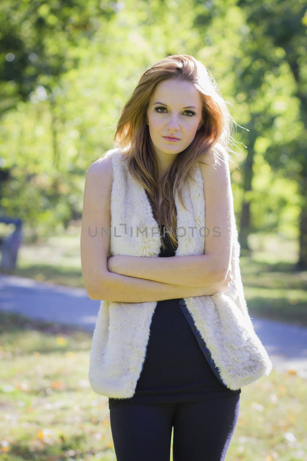 Young, beautiful woman in the city park