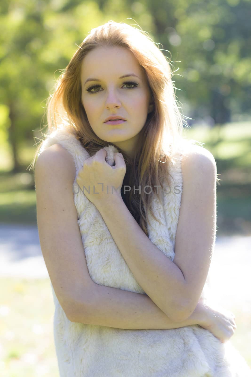 Young, beautiful woman in the city park