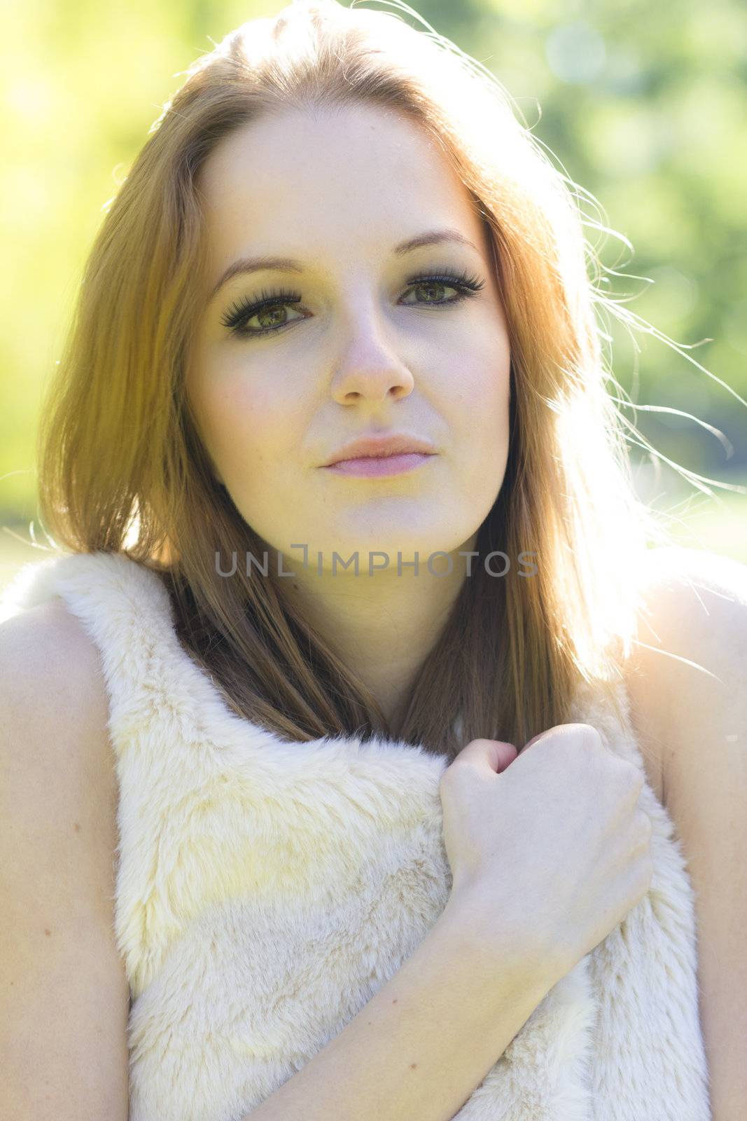 Young, beautiful woman in the city park