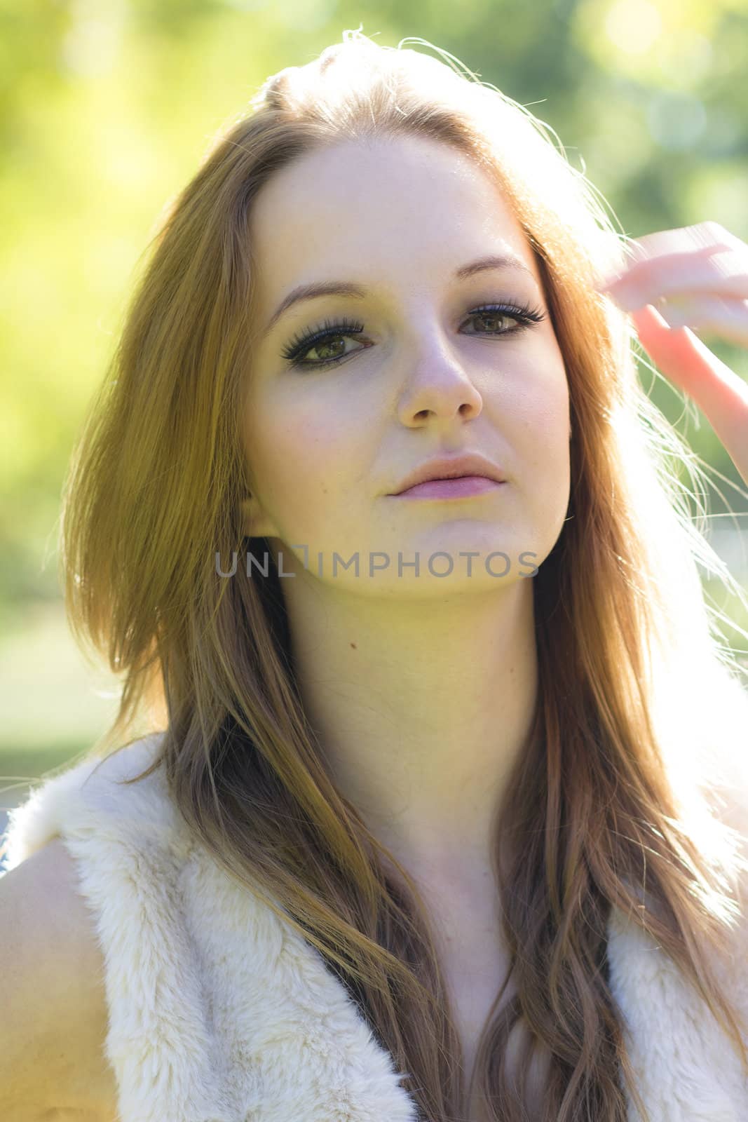 Young, beautiful woman in the city park