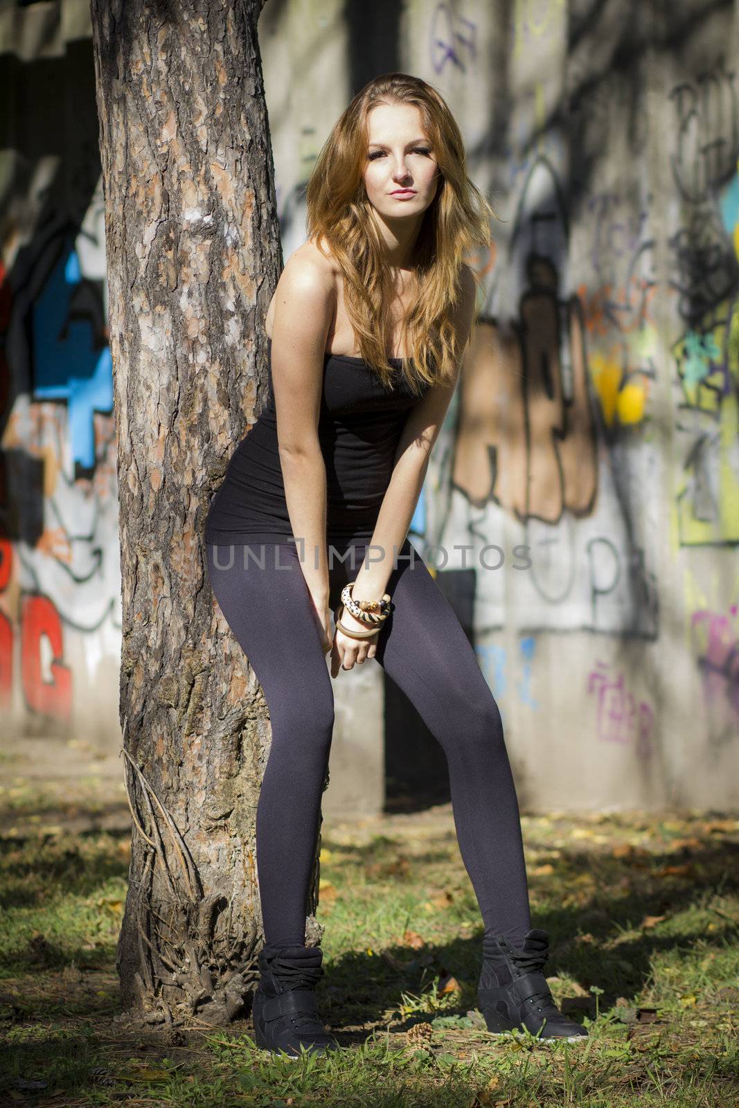 Young, beautiful woman in the city park