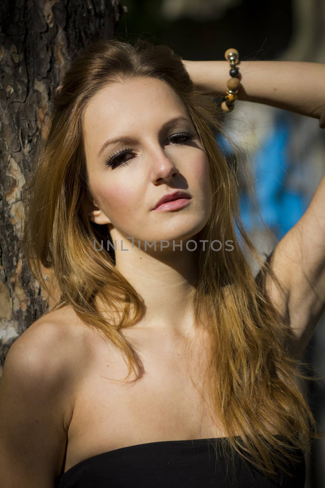 Young, beautiful woman in the city park