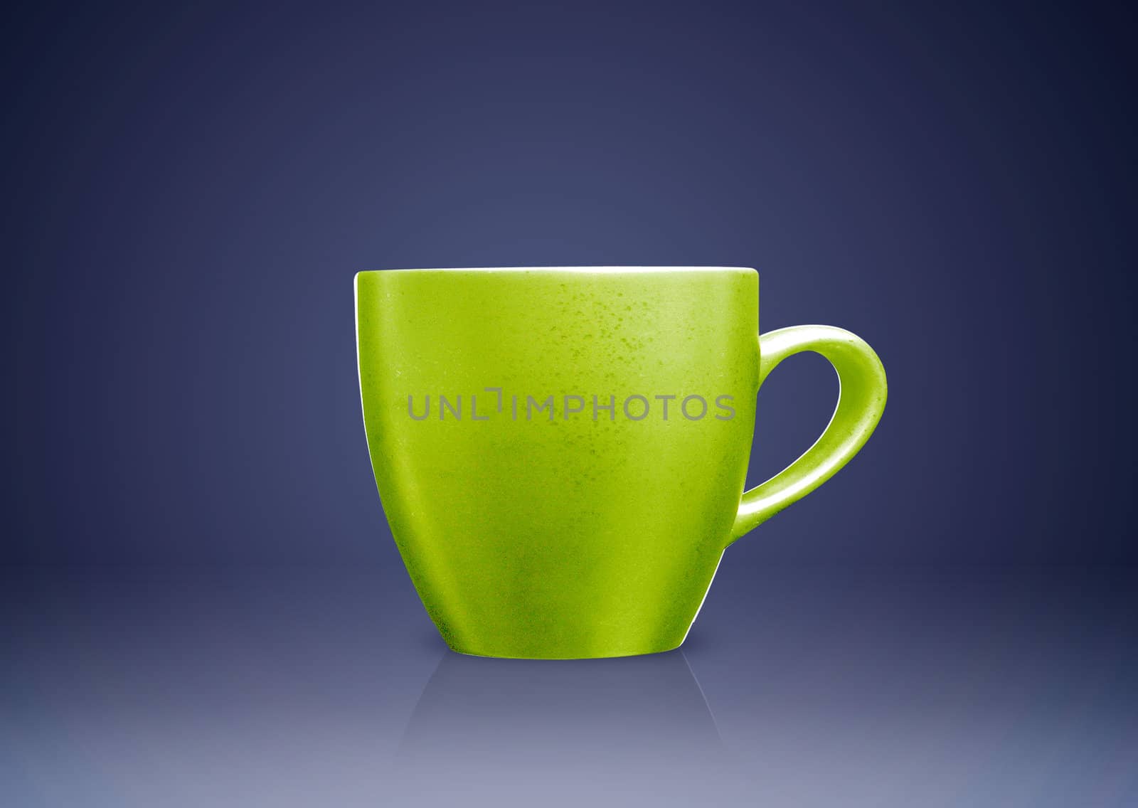 Green tea mug or cup on blue background.