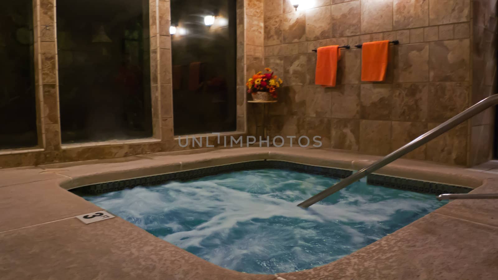 spa with warm marble tiles and towels