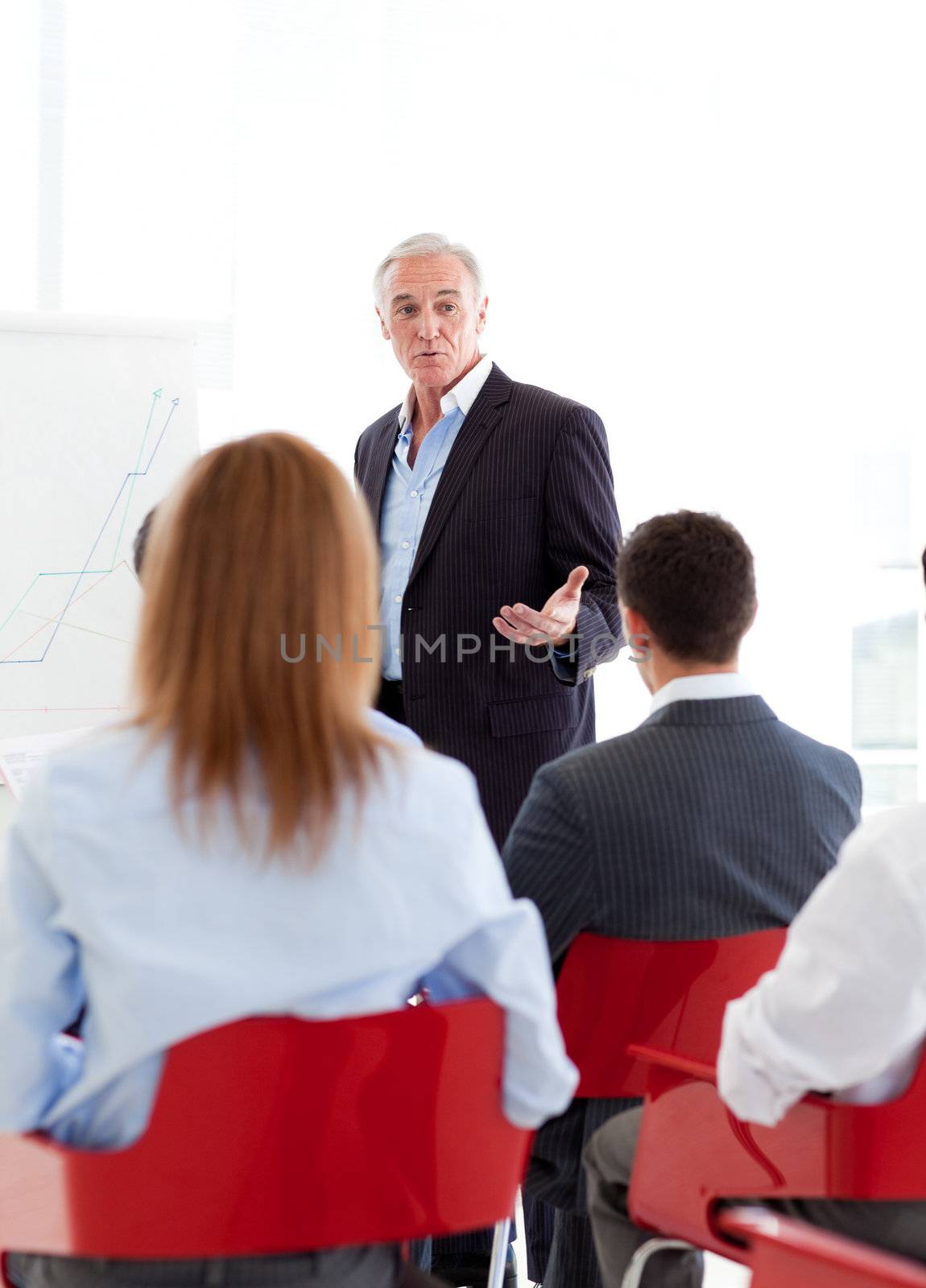 Senior businessman giving a conference by Wavebreakmedia