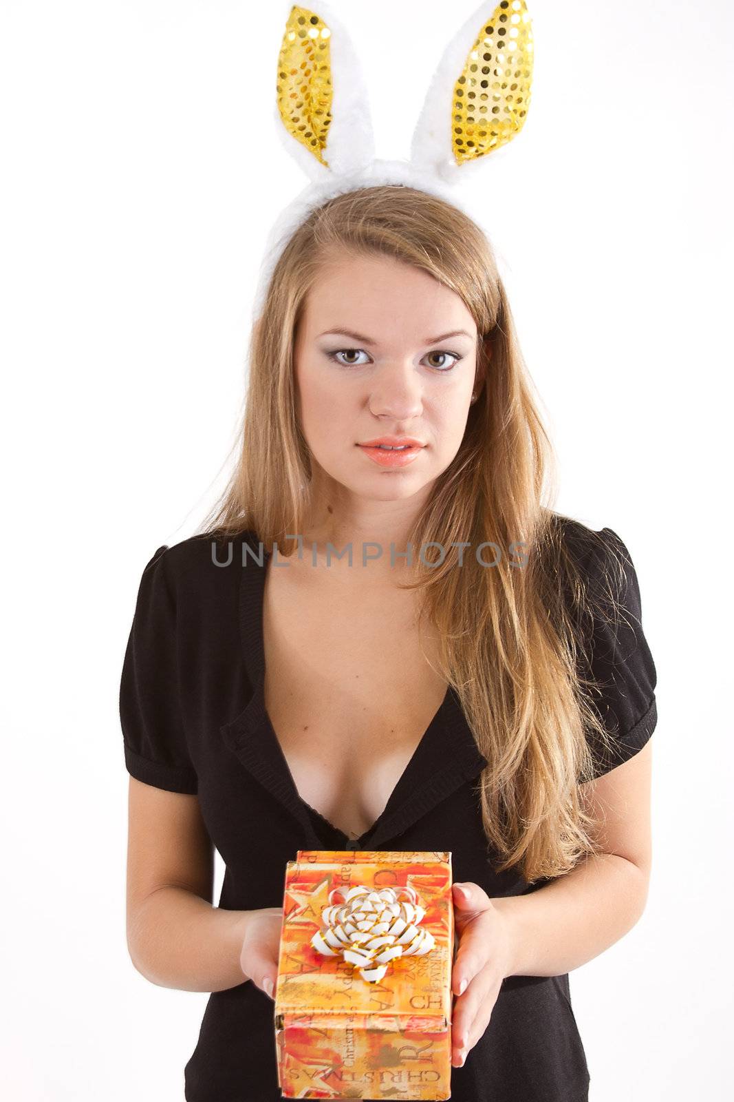 Portrait of a beautiful girl with rabbit ears with a gift in their hands