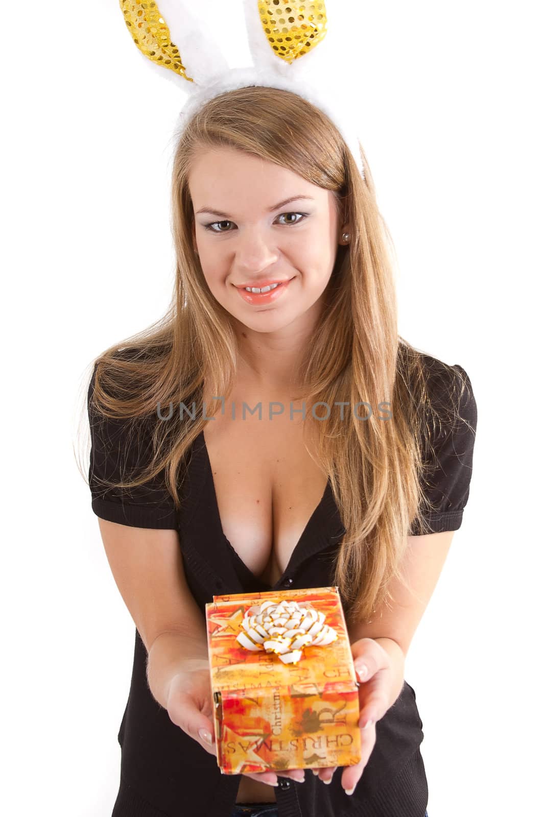 Portrait of a beautiful girl with rabbit ears with a gift in their hands