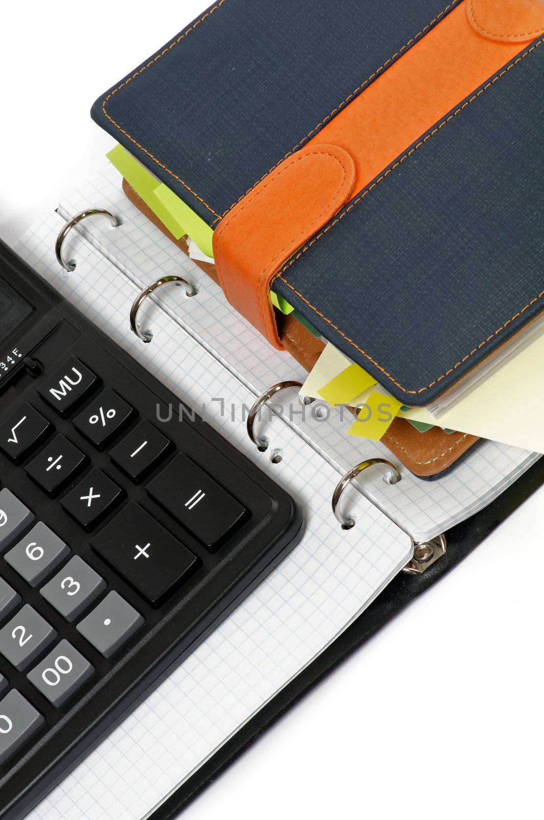Organizer and Calculator on Spiral Notebook closeup on white background