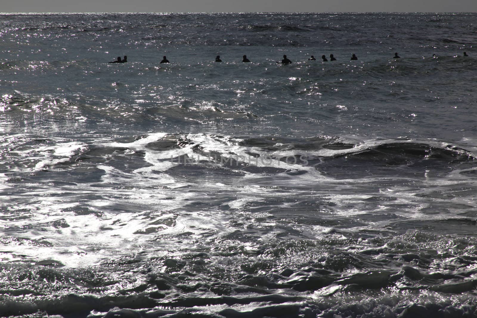 Surfers opening the season in Levanto, Italy.