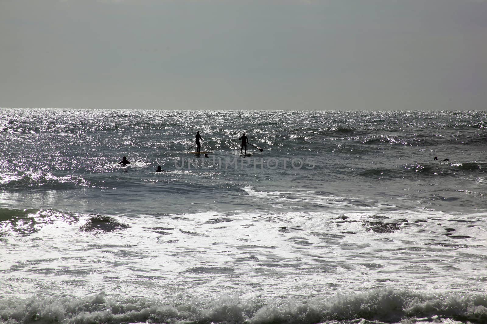 Surfers in Levanto, Italy by adrianocastelli