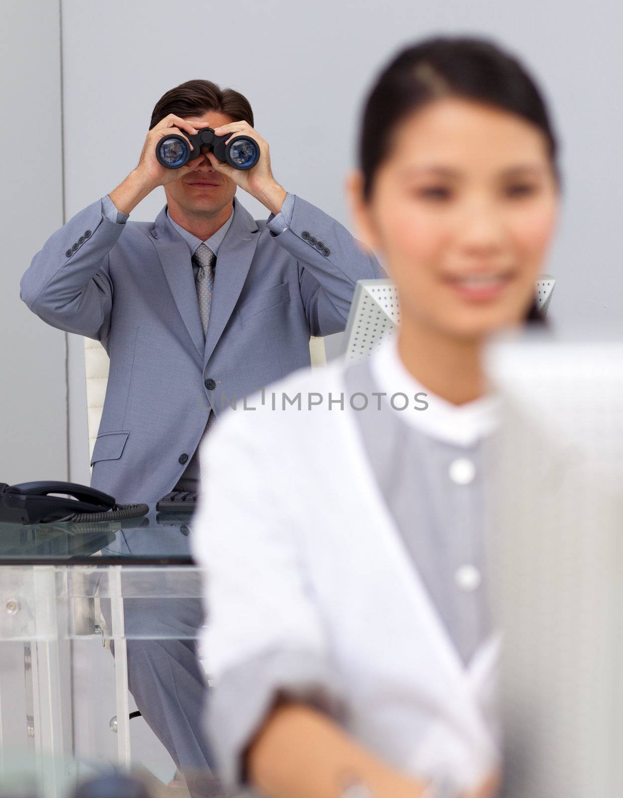 Visionary businessman using binoculars  by Wavebreakmedia