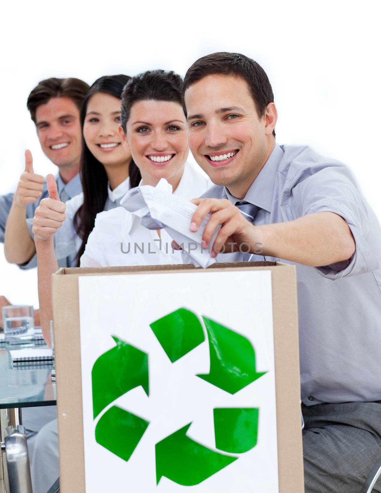 Young business people showing the concept of recycling against a white background