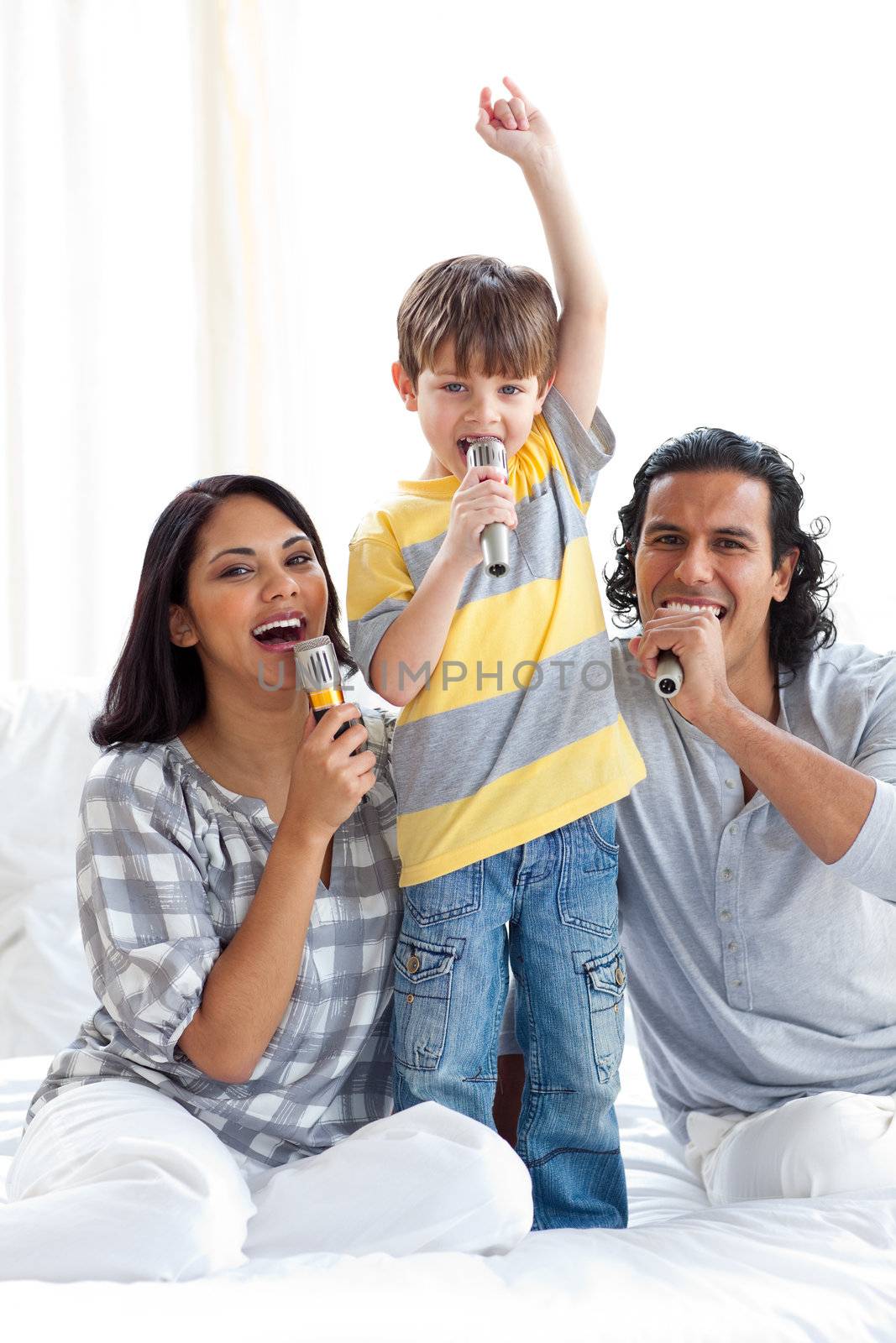 Animated family singing with microphones  by Wavebreakmedia