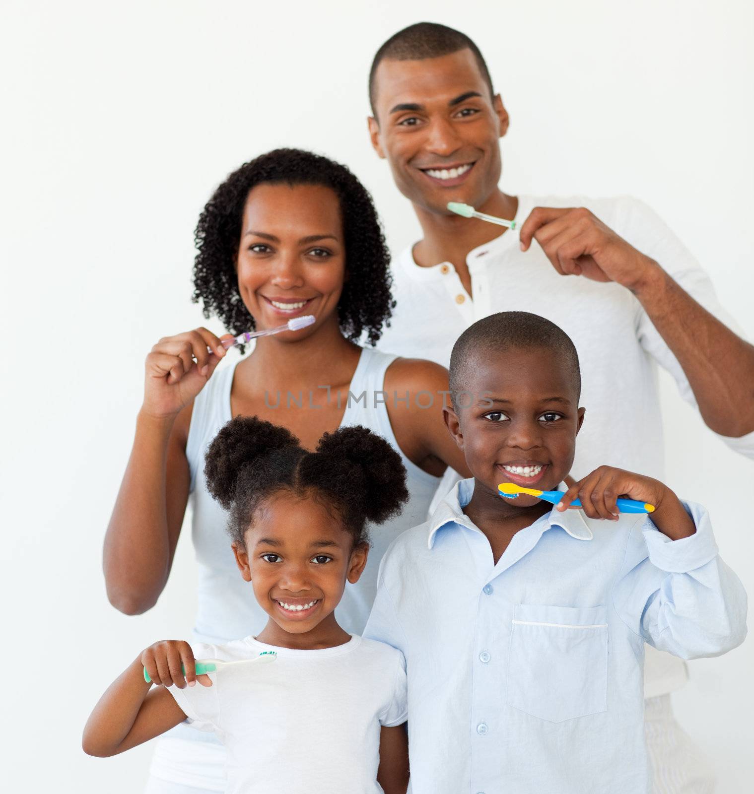 Afro-american family brushing their teeth by Wavebreakmedia