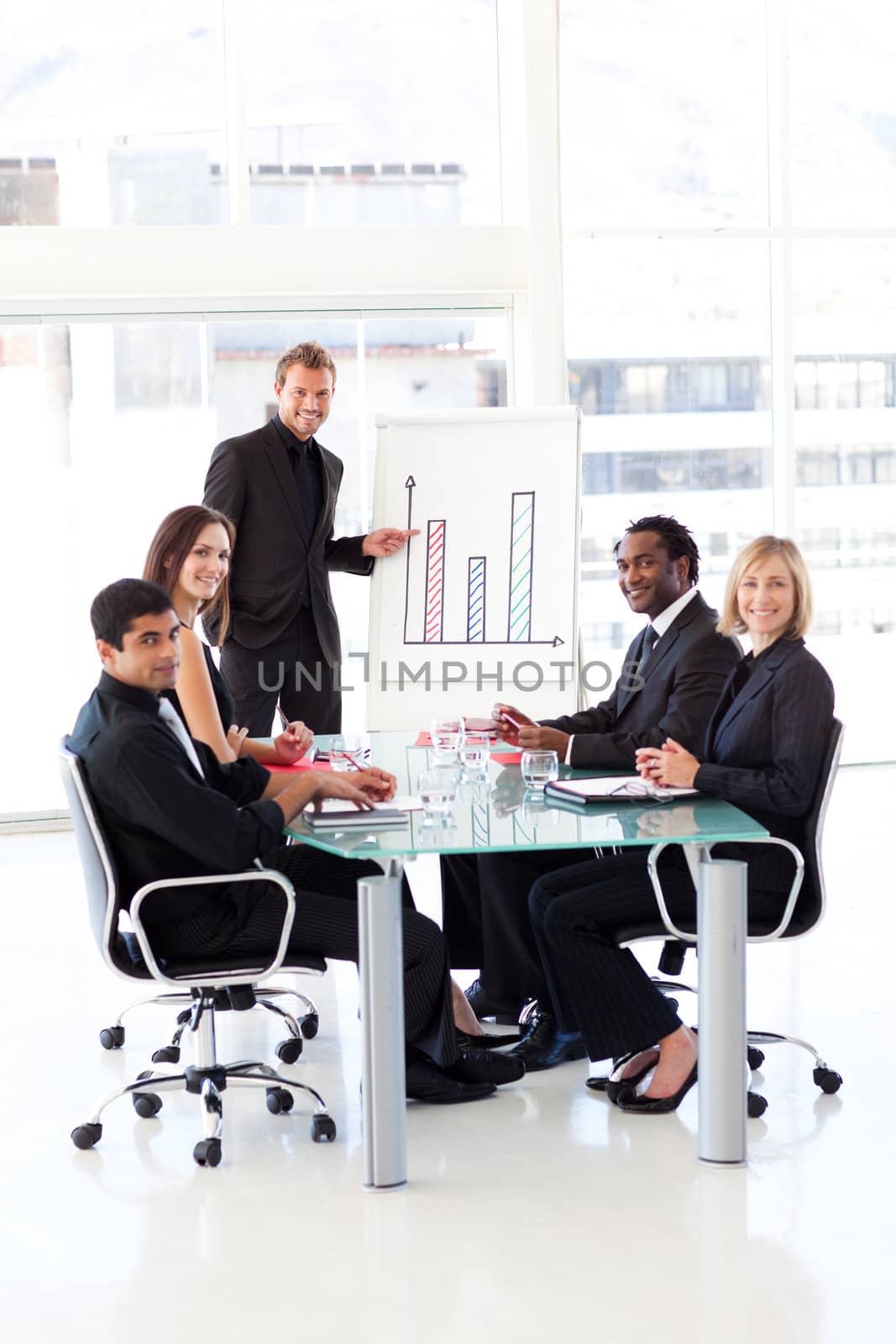 Young businessman giving a presentation to his team