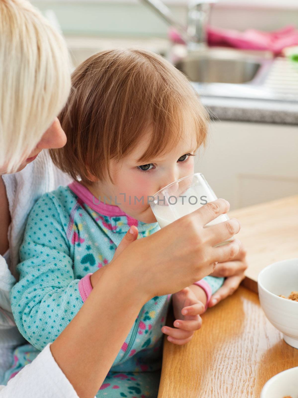 Beauty mother and daughter having breakfast by Wavebreakmedia