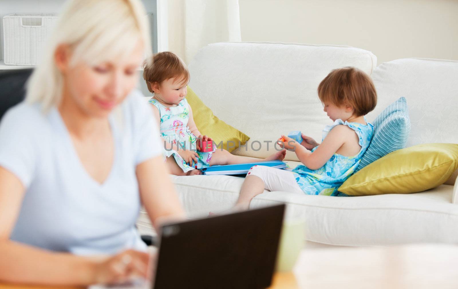 Relaxed family having fun with a laptop in the living-room at home 