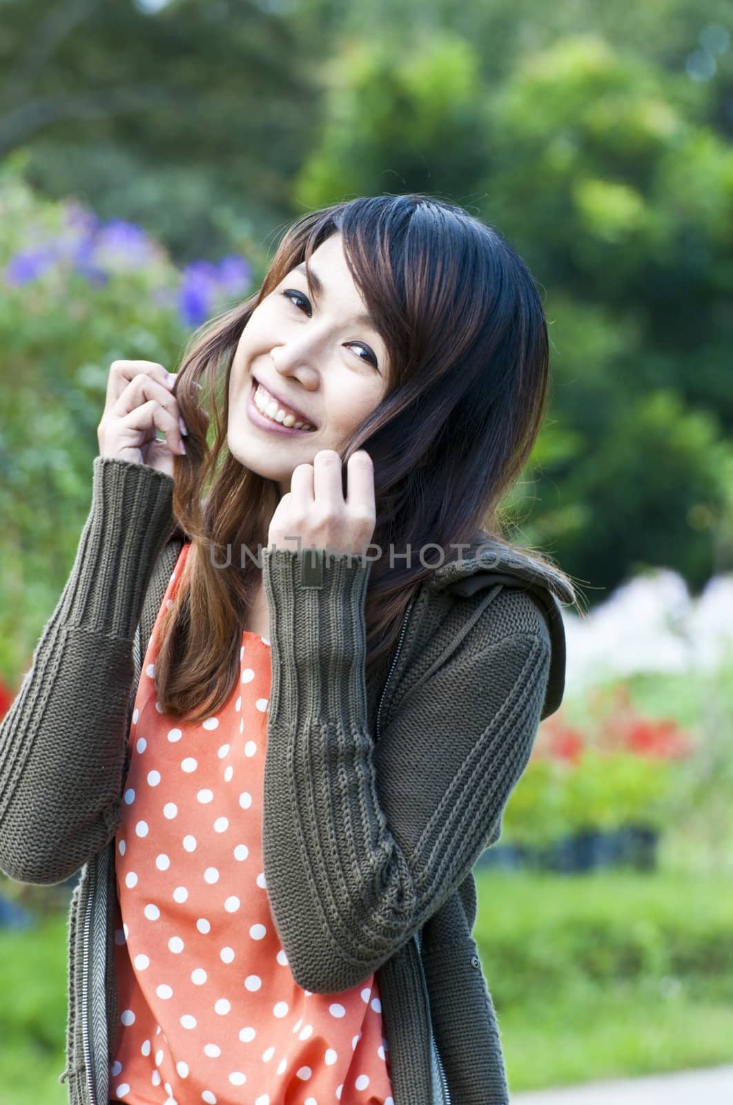 Portrait Of Asian Young Woman In garden in winter season