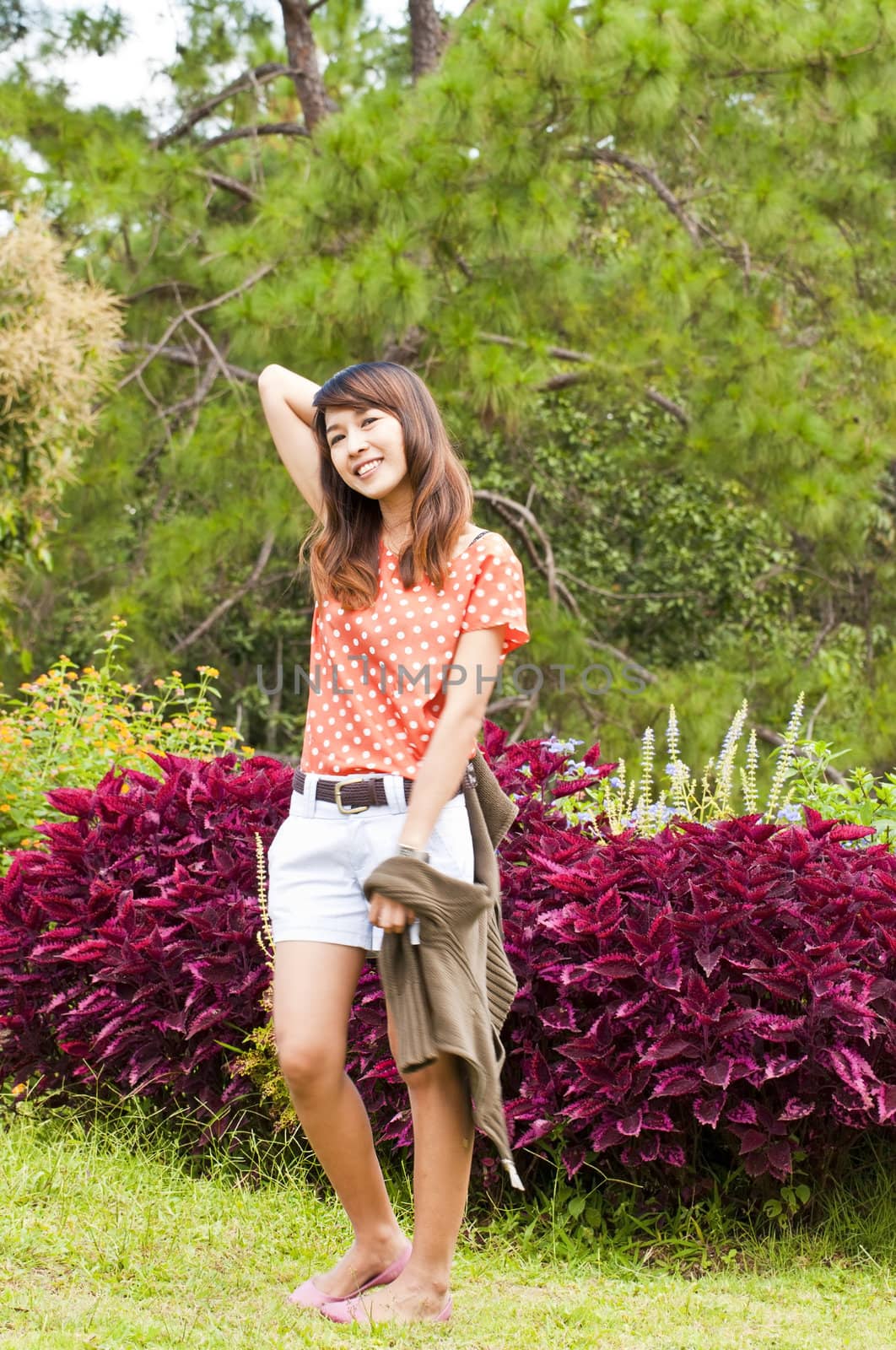 Portrait Of Asian Young Woman In garden in winter season