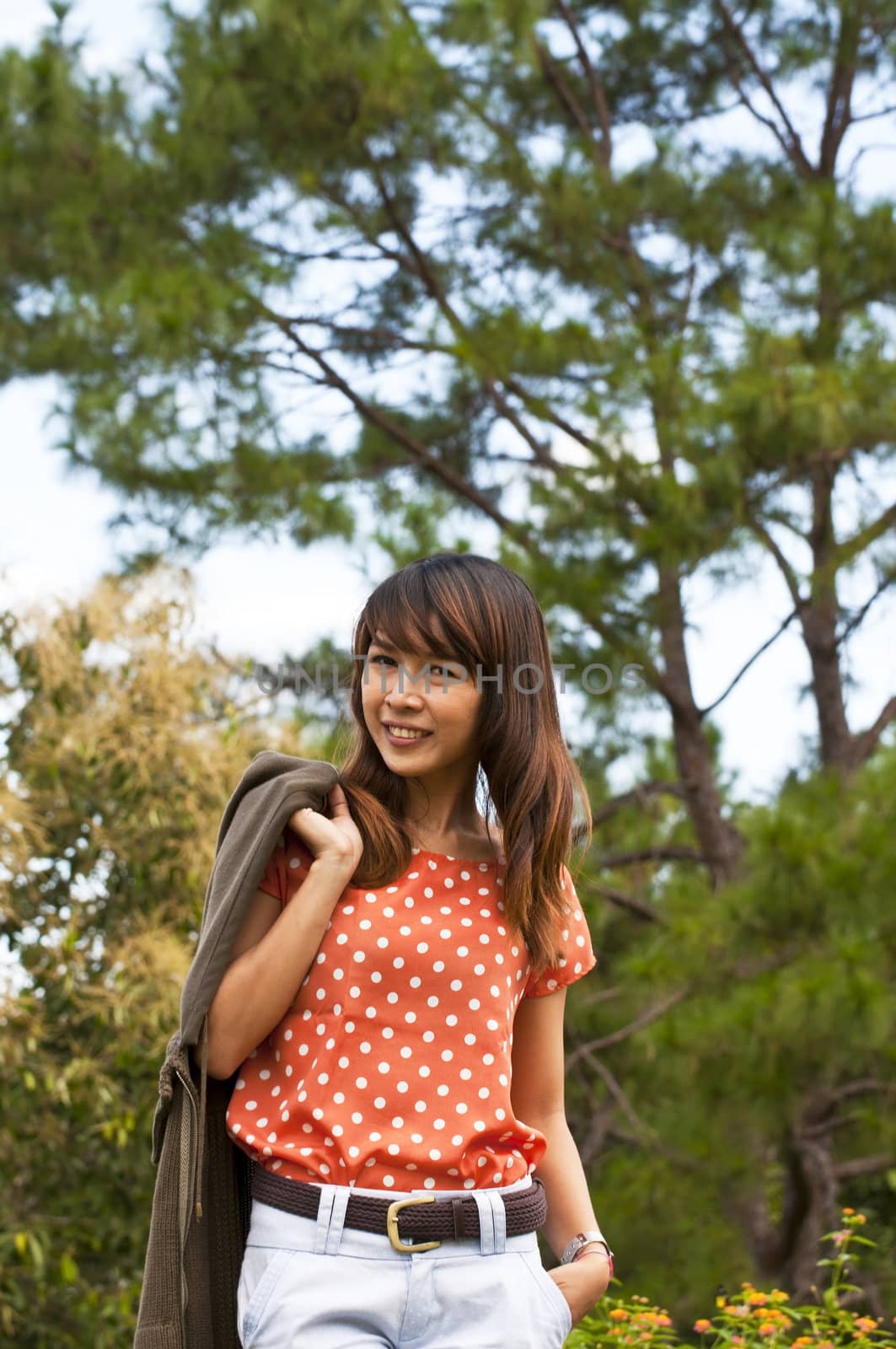 Portrait Of Asian Young Woman In garden in winter season