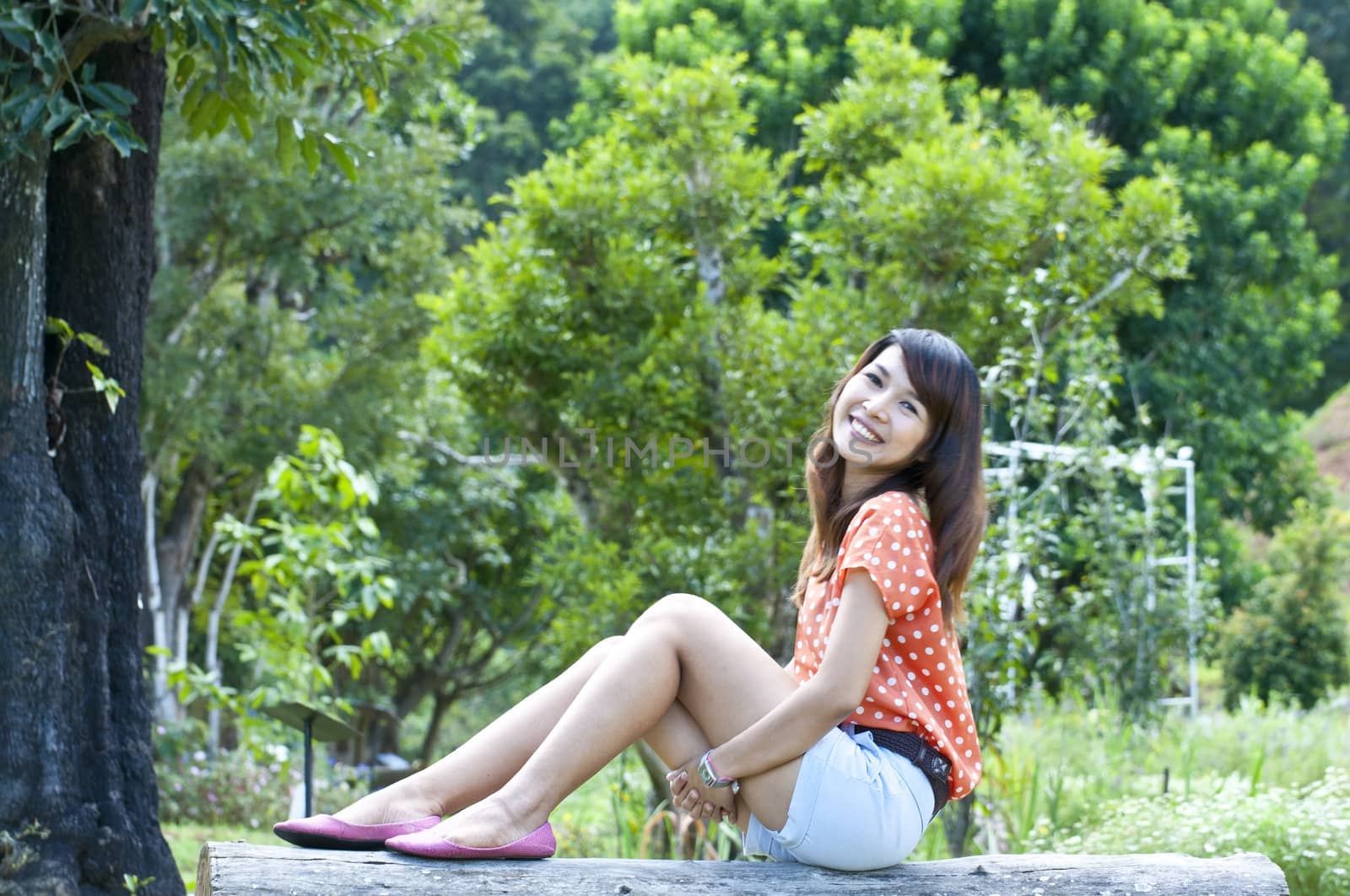 Portrait Of Asian Young Woman In garden in winter season