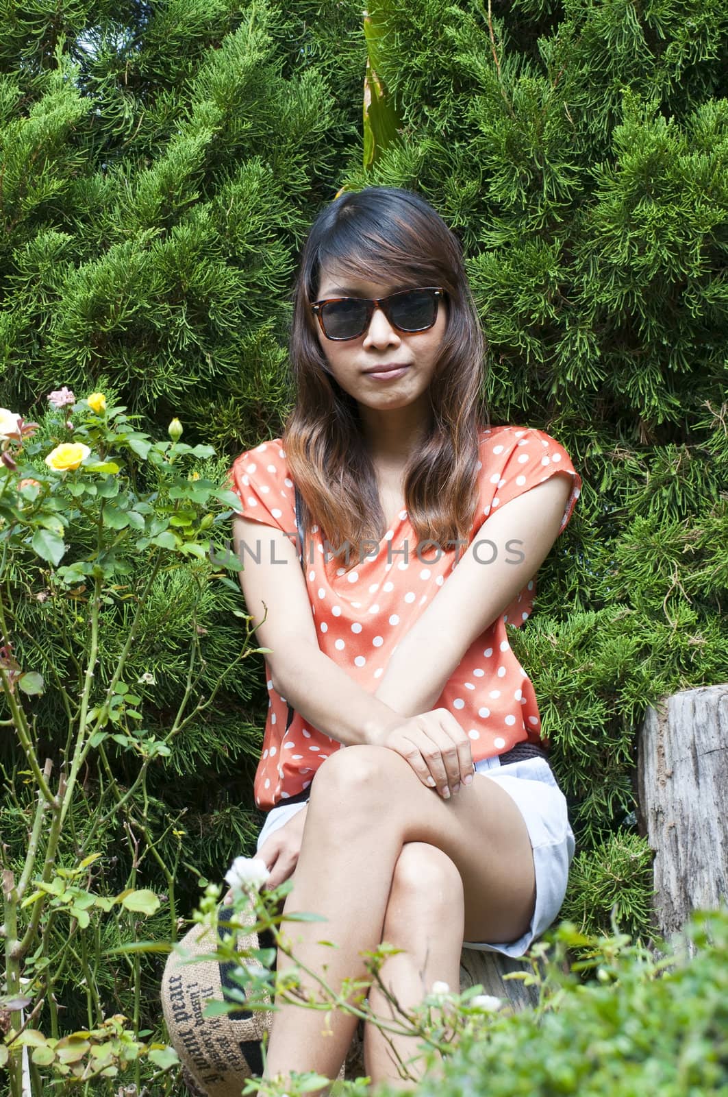 Portrait Of Asian Young Woman In garden in winter season