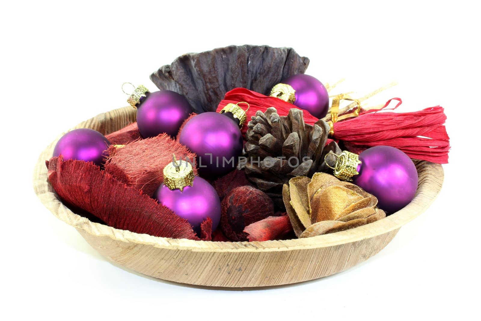 a wooden bowl with Christmas decorations