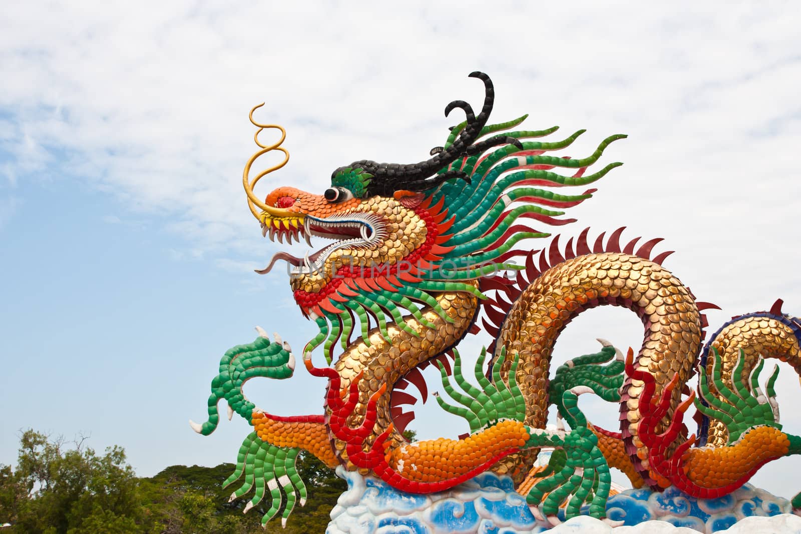 Chinese Dragon statue against blue sky