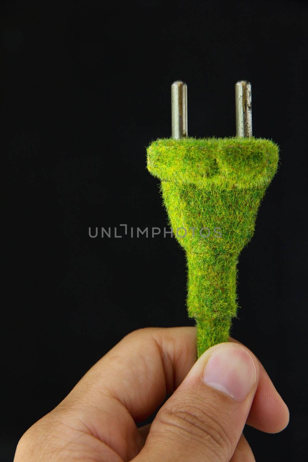 abstract image of green electric plug by ponsulak