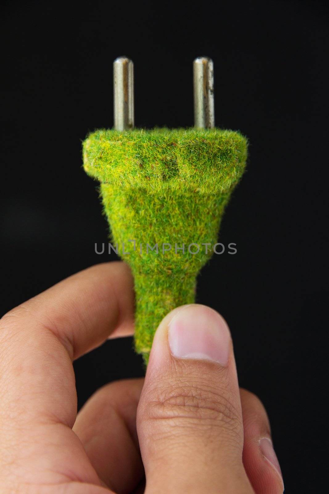 abstract image of green electric plug by ponsulak