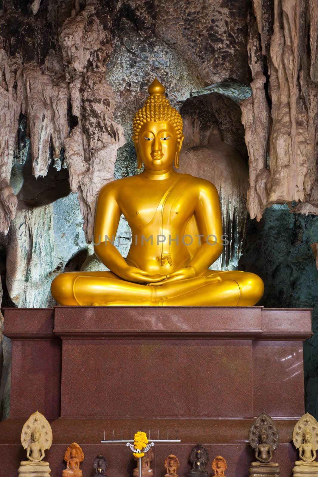 Golden buddha statue in the cave, Thailand