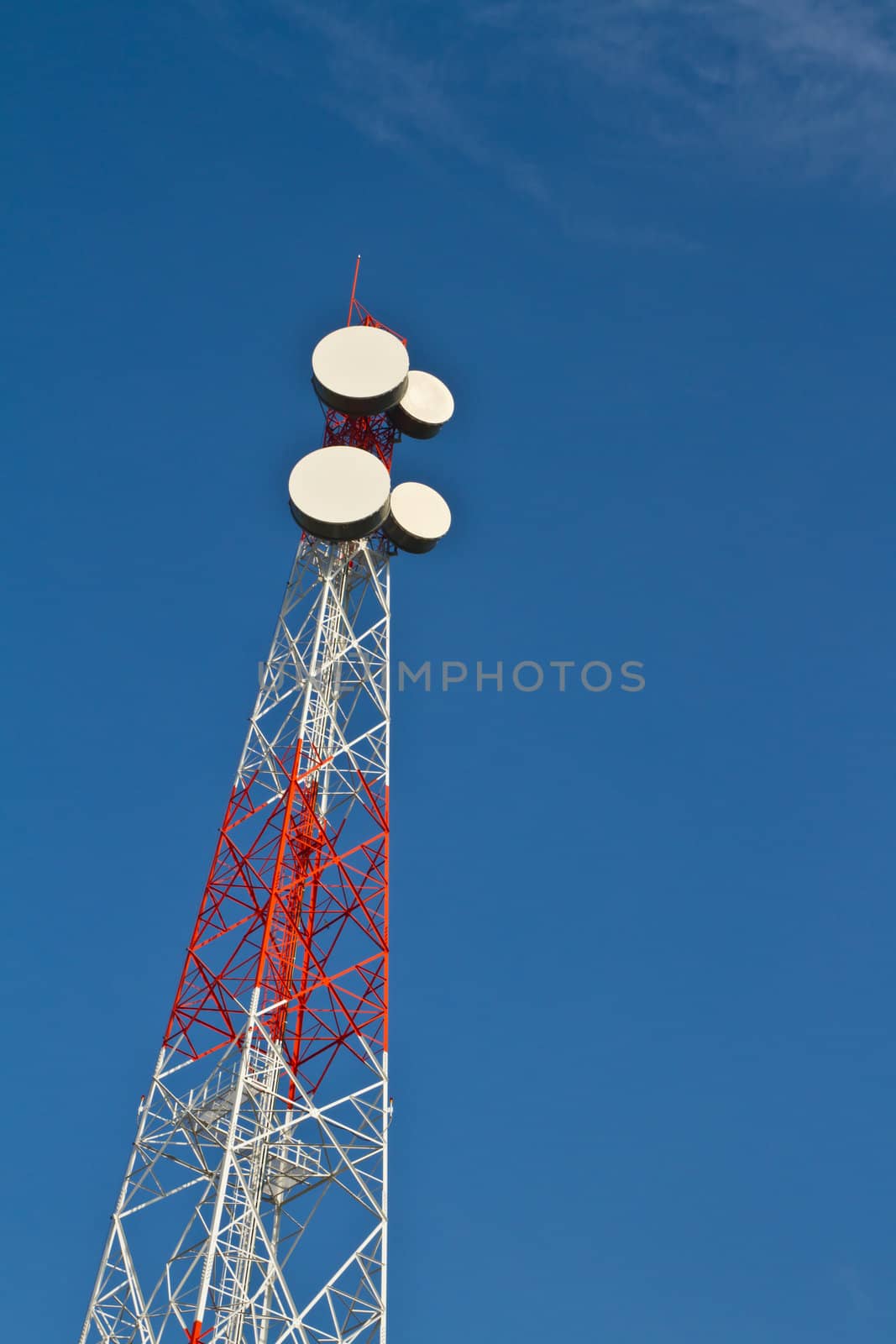 Communication tower against blue sky