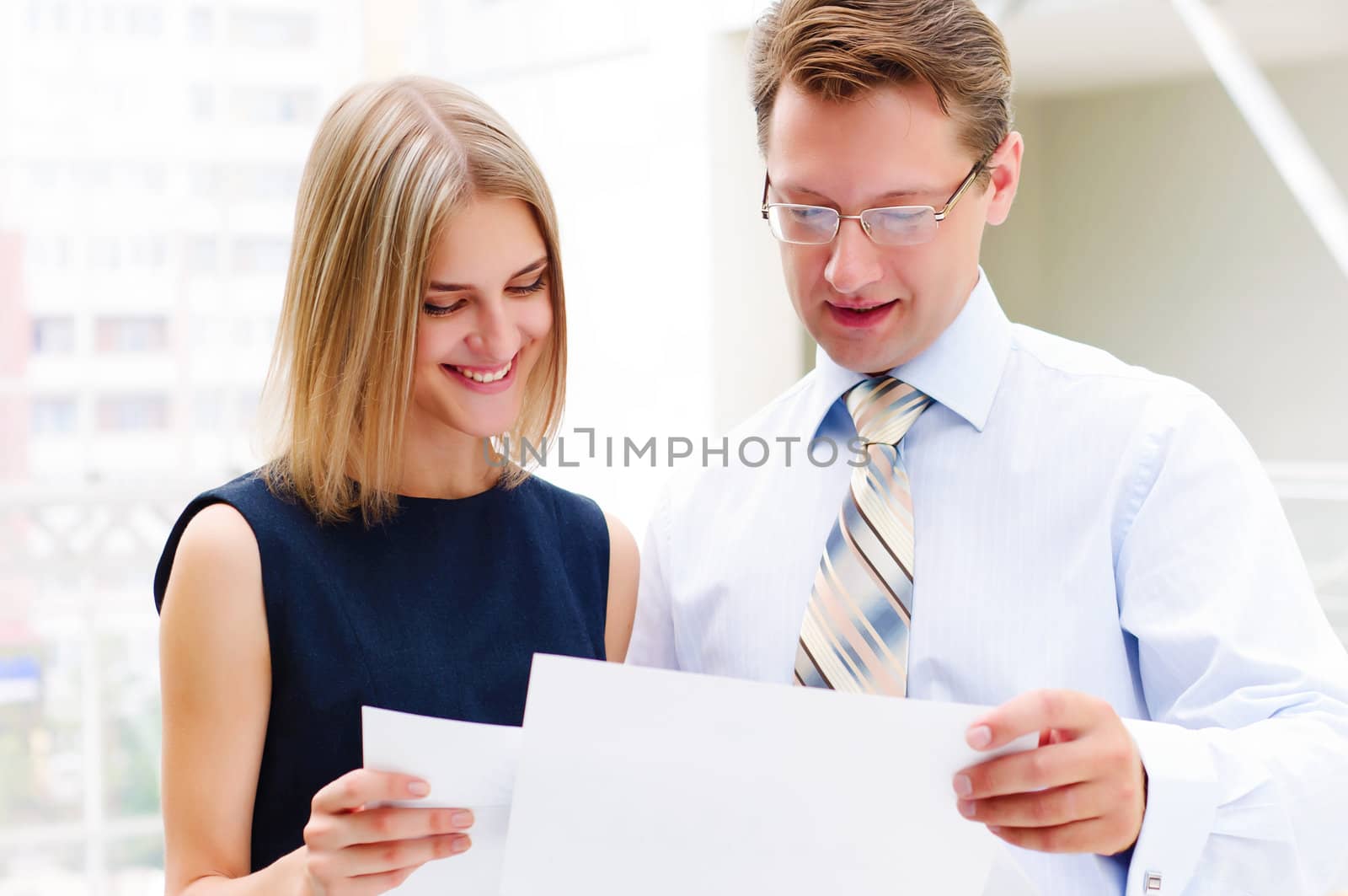 Portrait of young male and female entrepreneurs working together