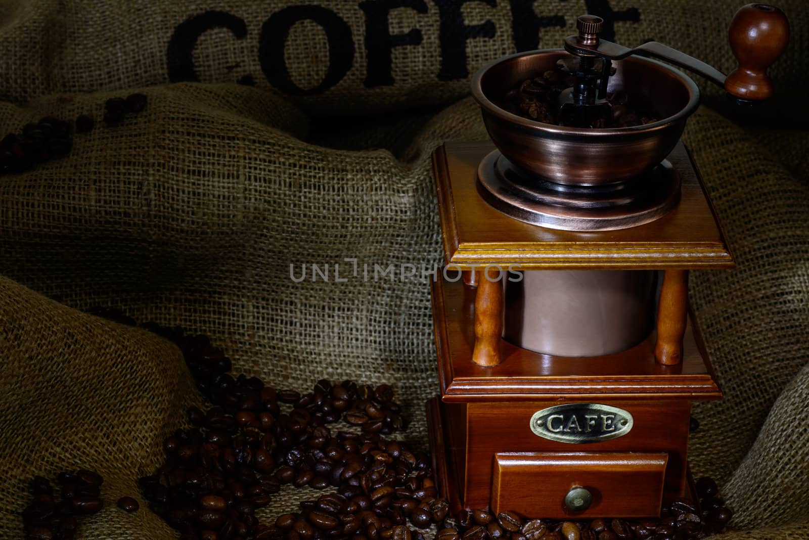 Coffee Mill with beans and burlap. still life