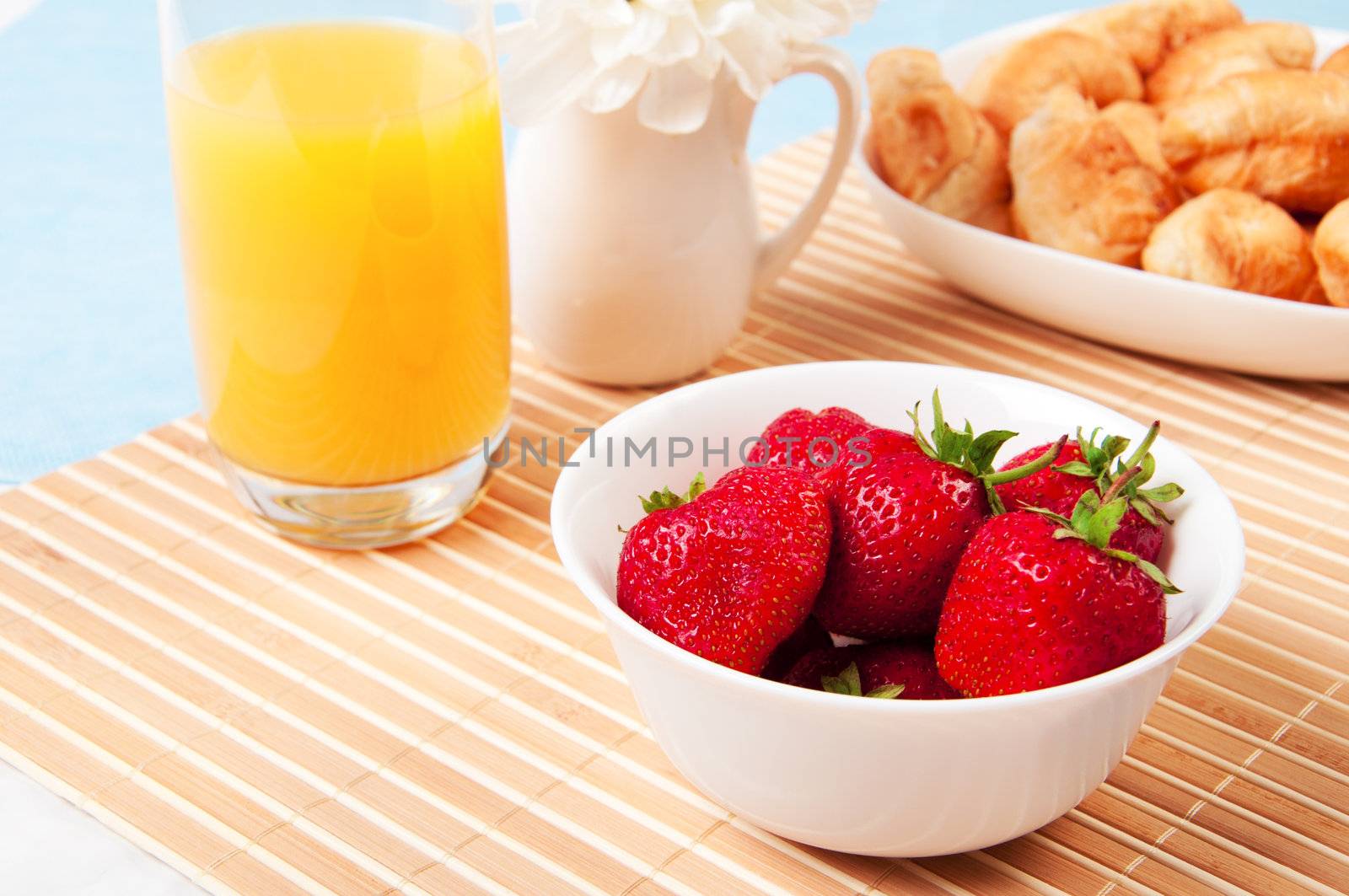 Breakfast with berries,orange juice and croissant, early breakfast