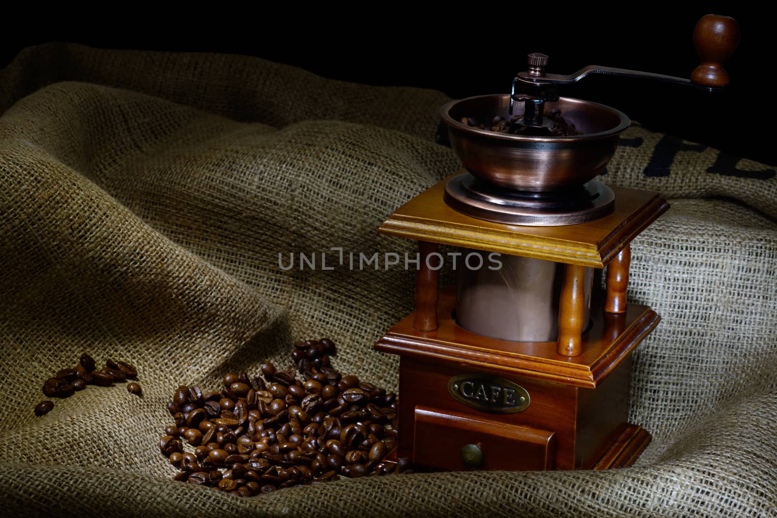 Coffee Mill with beans and burlap. still life