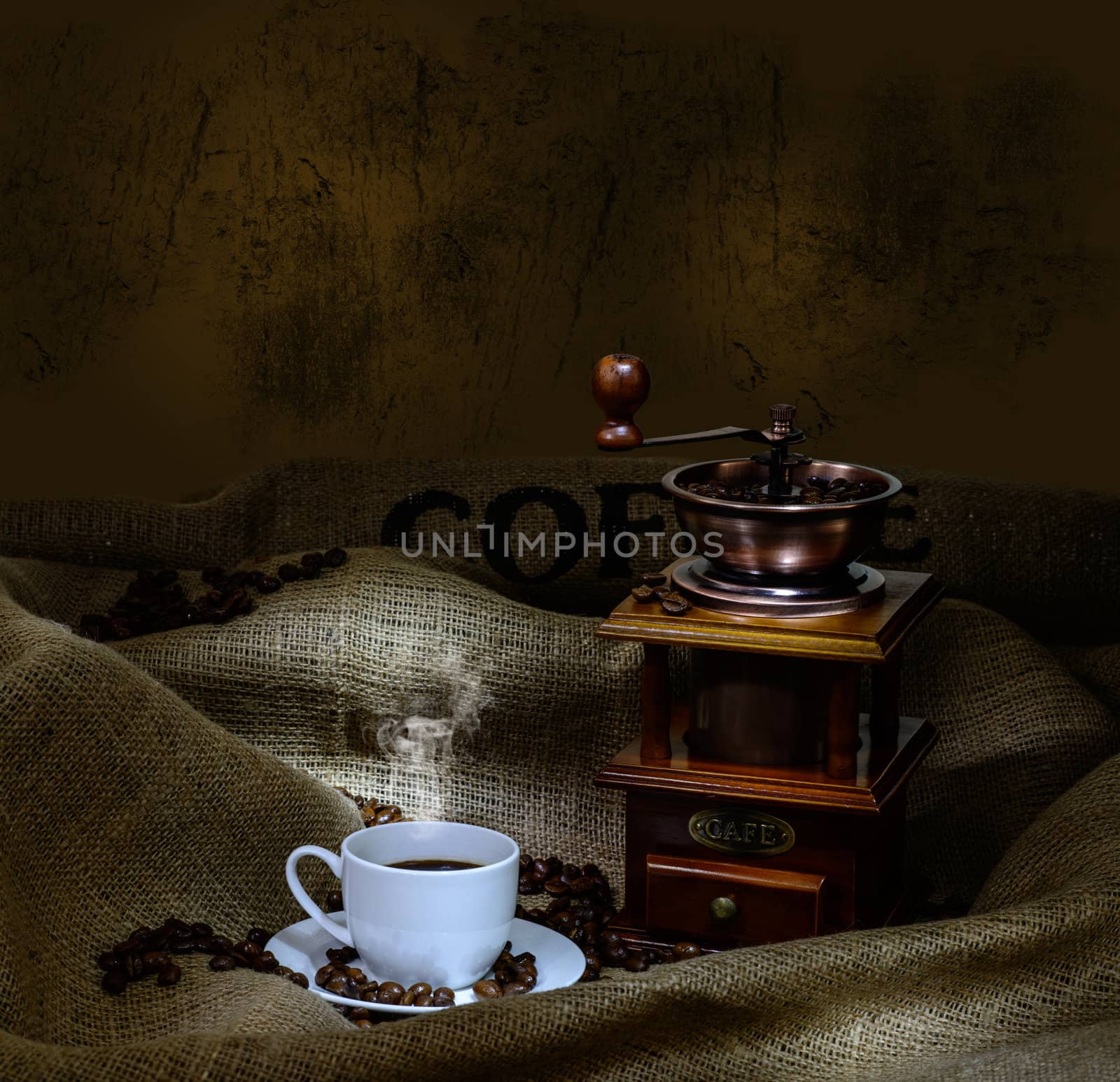 Coffee Mill with beans, cup and burlap. still life