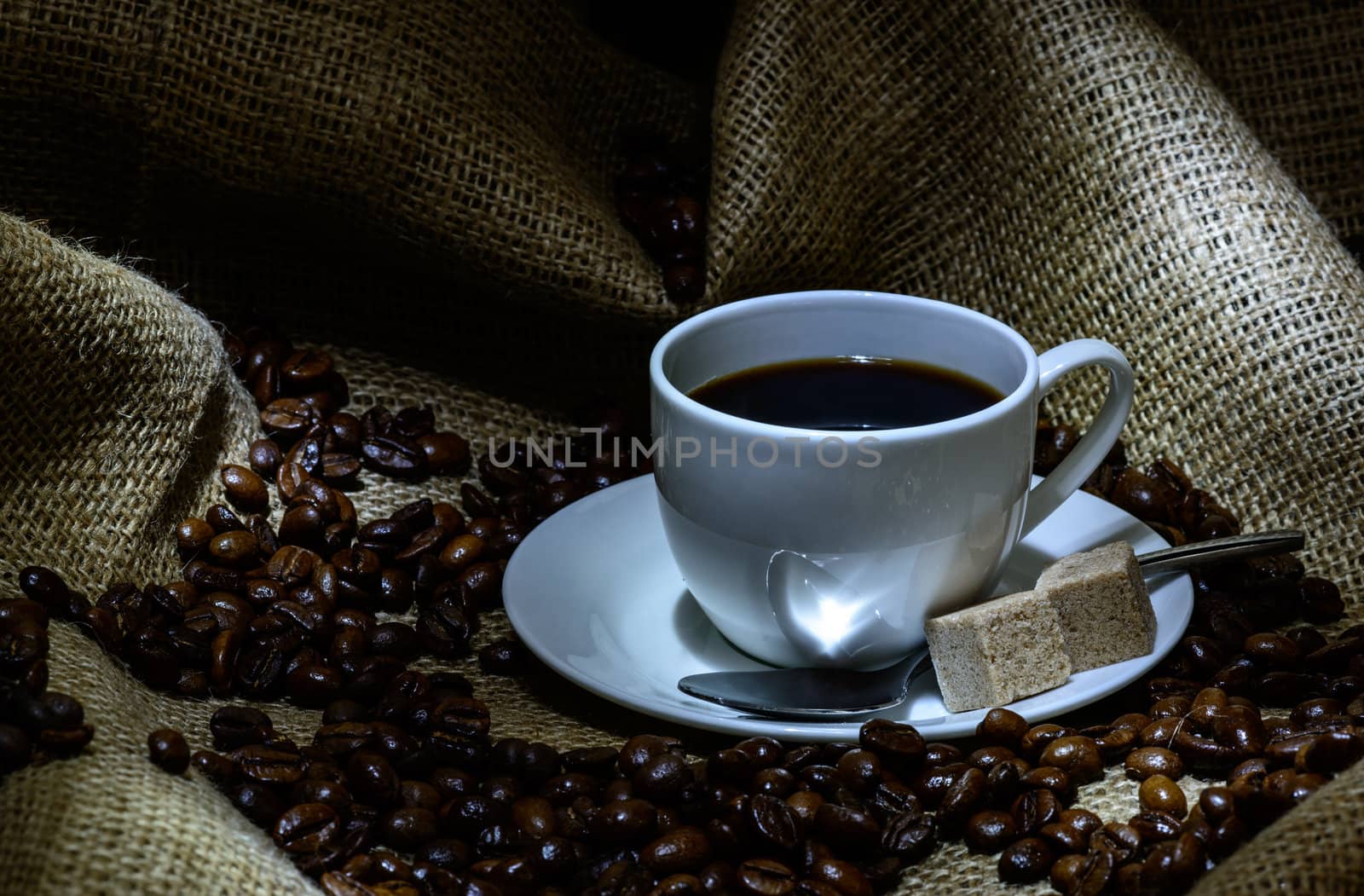 Coffee cup,  beans and burlap. still life