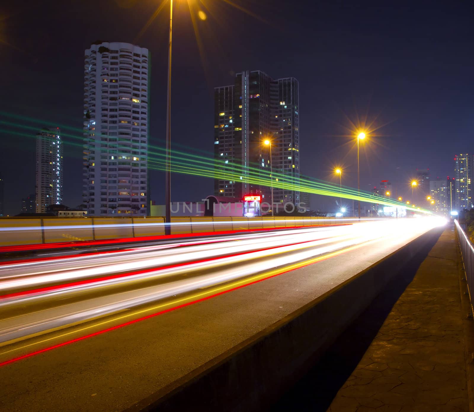 Light in car on city streets at night in Bangkok, Thailand.