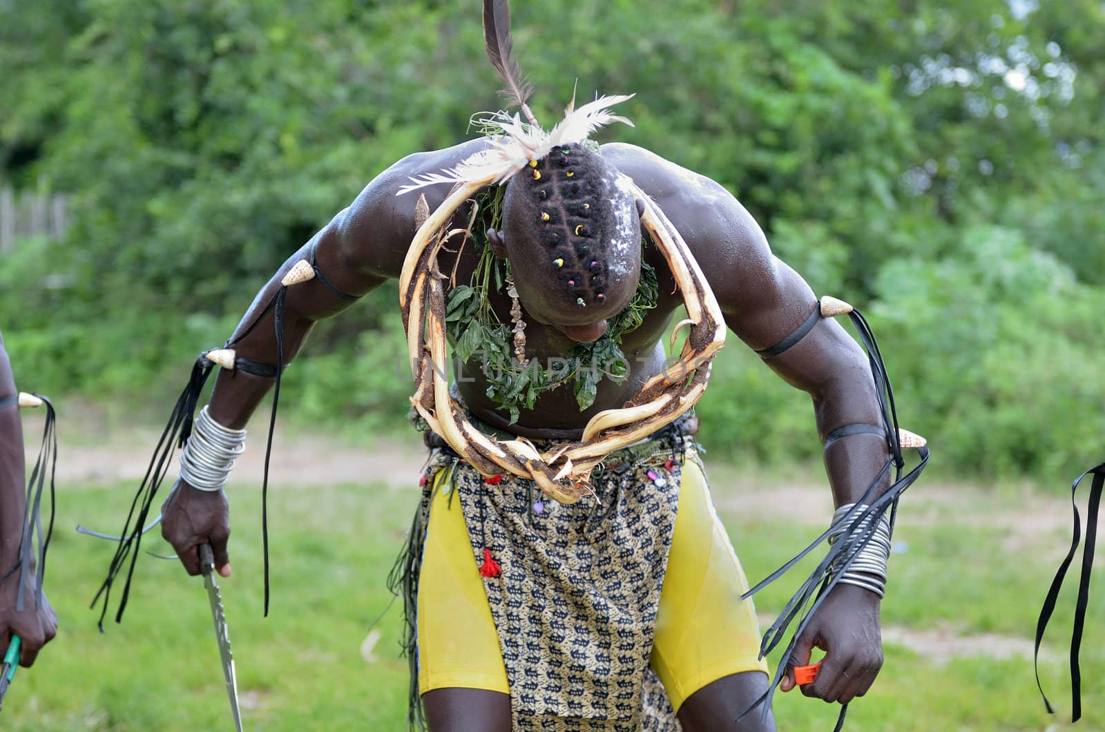 African man performs in a tribal dance