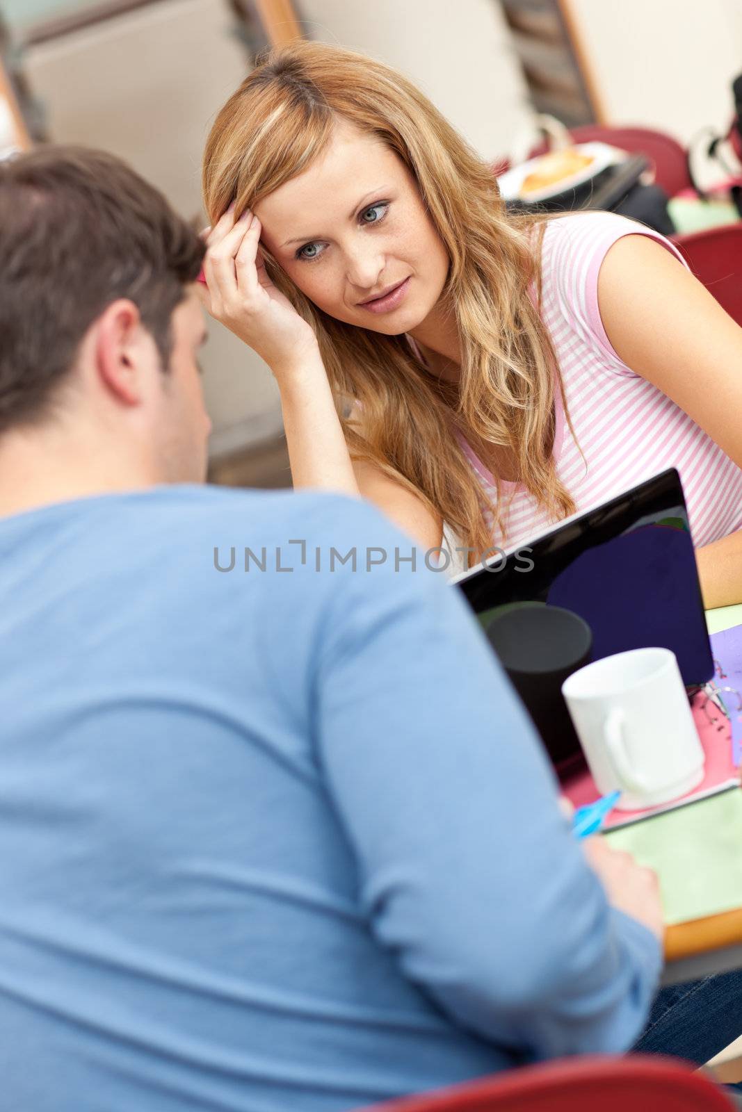 Portrait of two young people studying together by Wavebreakmedia