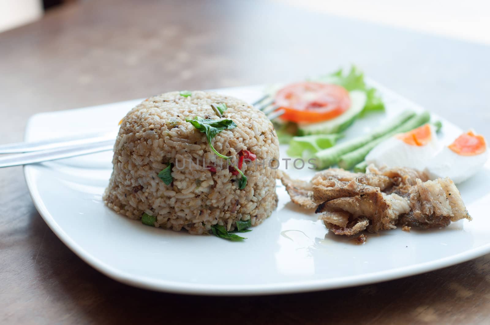 spicy fried rice with fried fish with salted egg