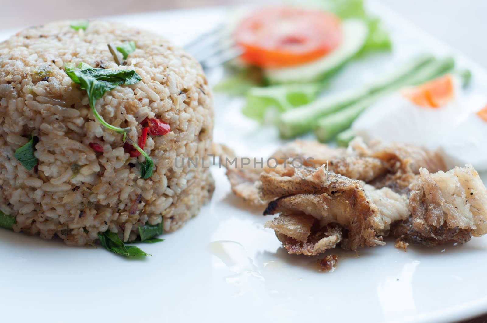 spicy fried rice with fried fish with salted egg