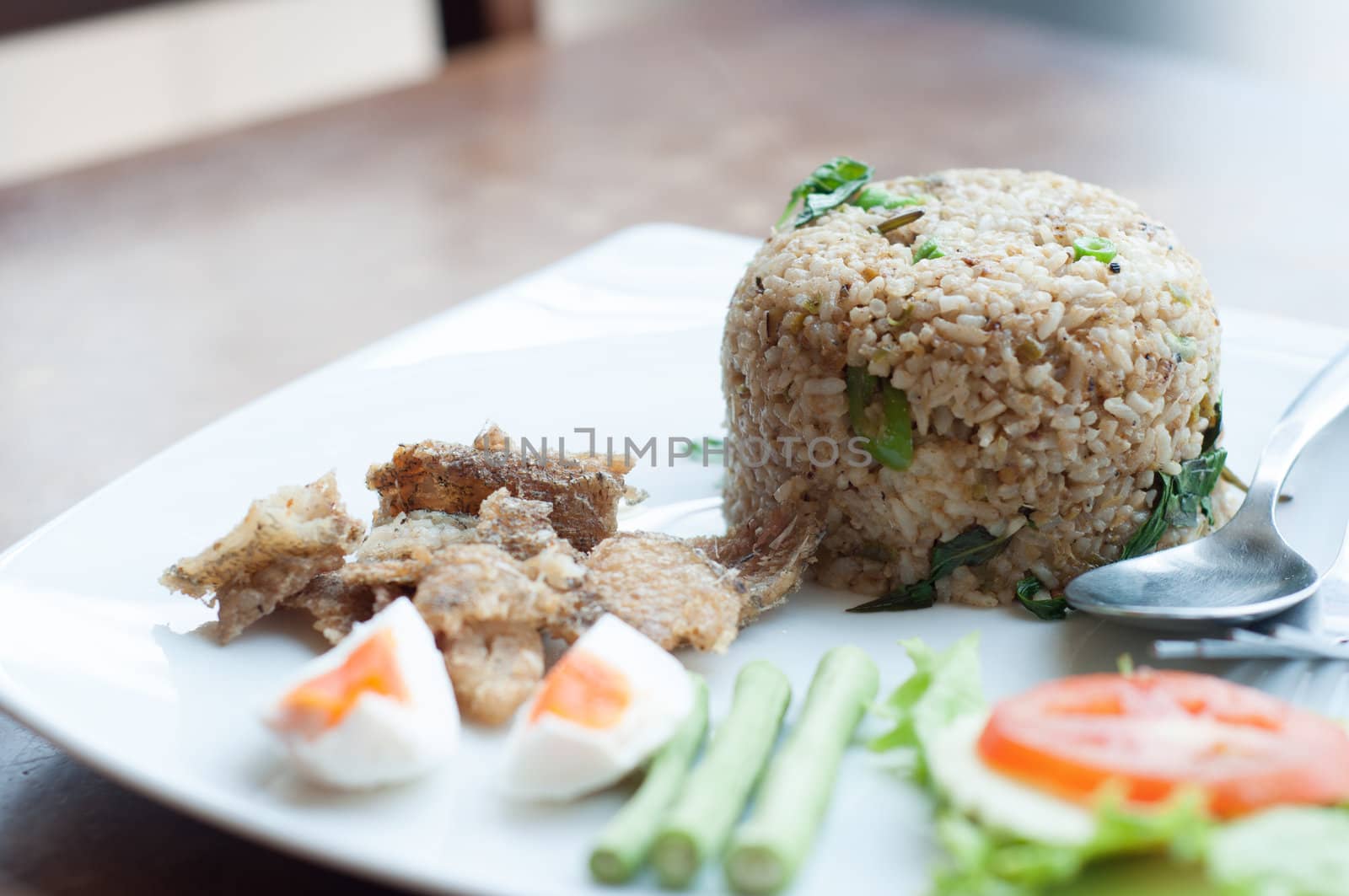 spicy fried rice with fried fish with salted egg