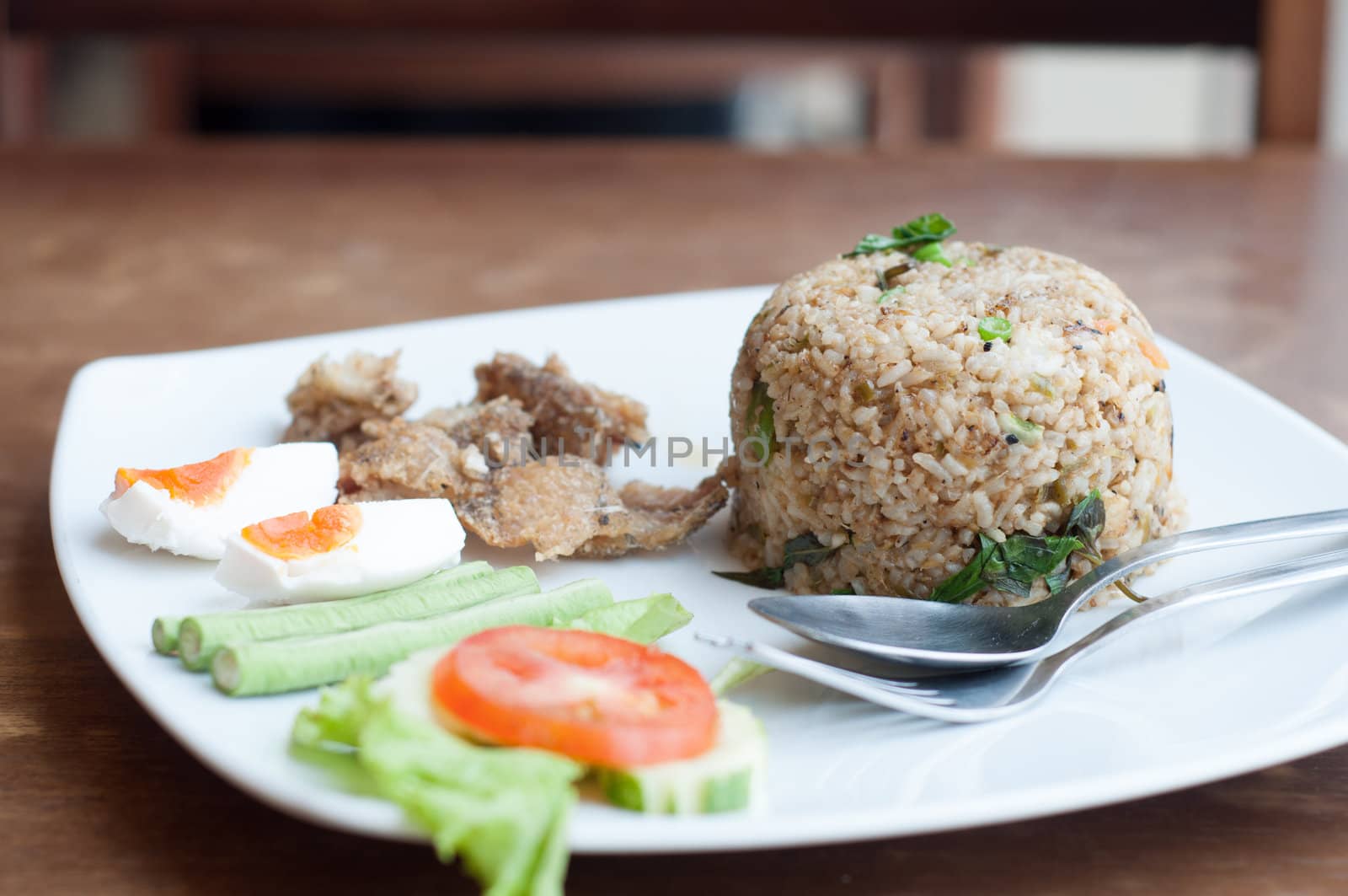 spicy fried rice with fried fish with salted egg