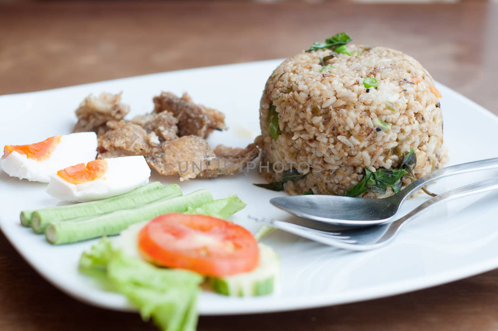 spicy fried rice with fried fish with salted egg